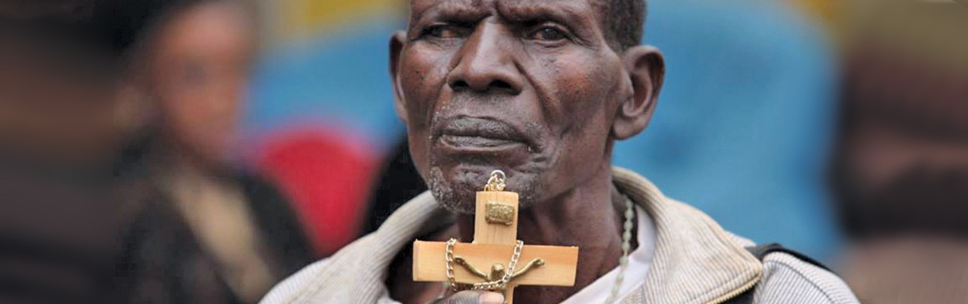 Man with cross at celebration